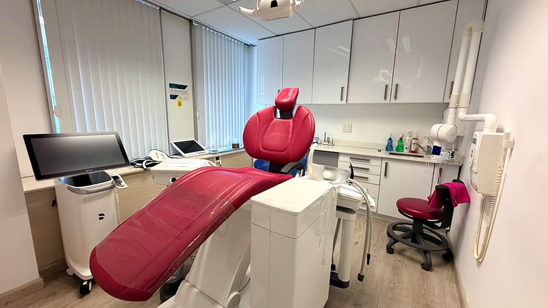 Second treatment room with a chairside monitor and wall-mounted X-ray arm